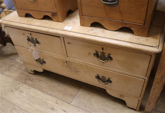 A pine three drawer low chest, W.104cm